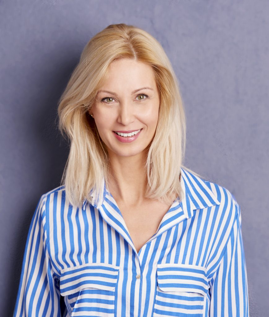 Blonde woman in a blue and white striped shirt