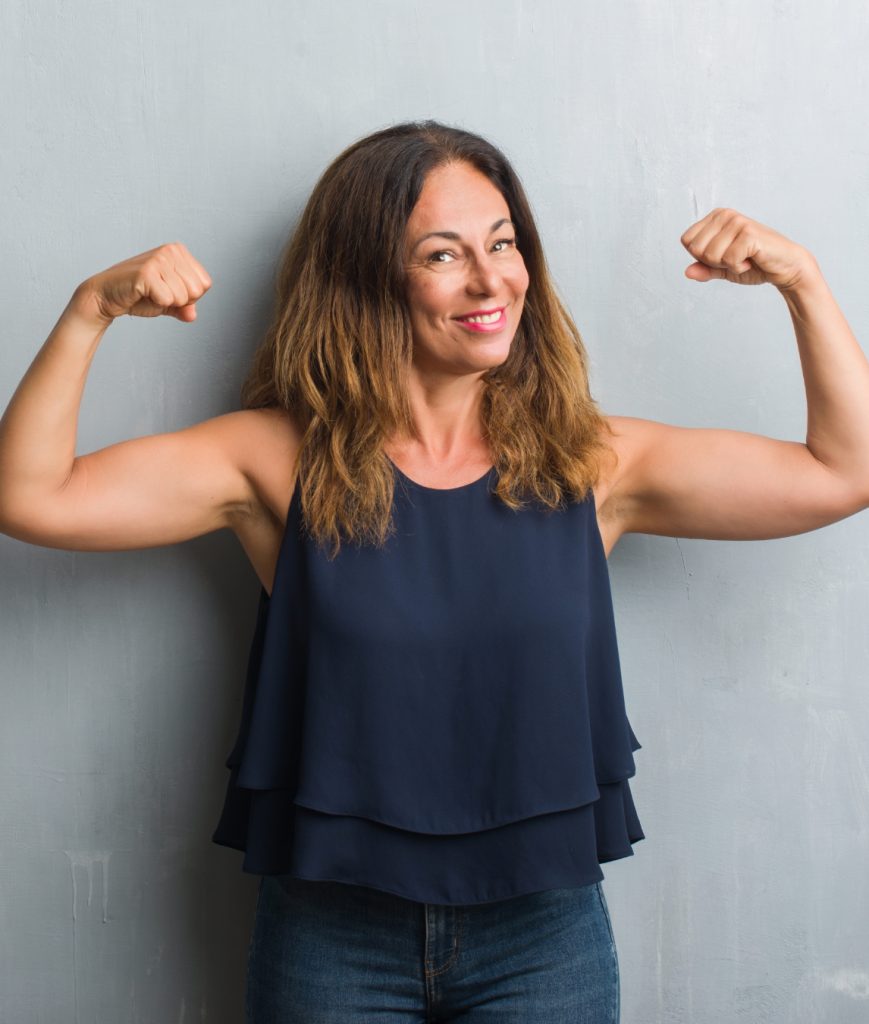 Middle age woman flexing