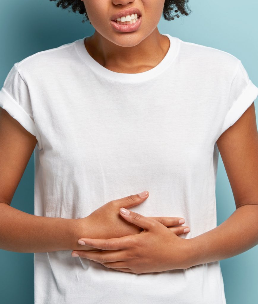Woman with her hands over her stomach
